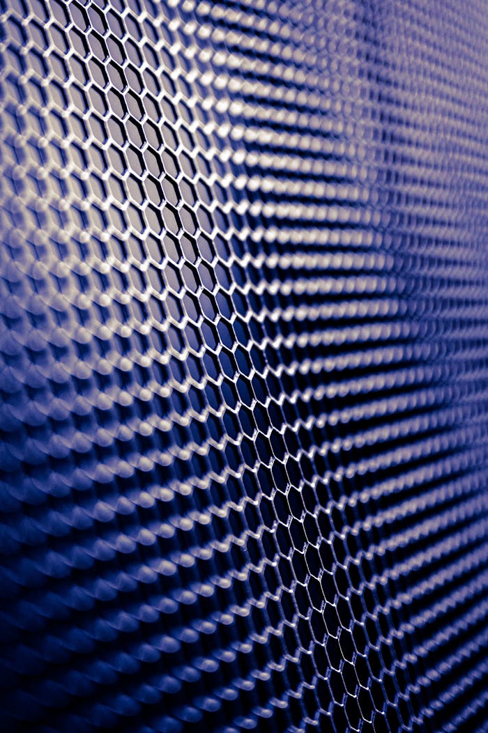 Close-up of a futuristic metallic hexagonal pattern, perfect for tech designs.